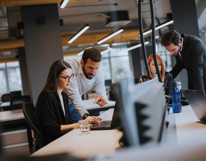 Group of young business people are working together with desktop